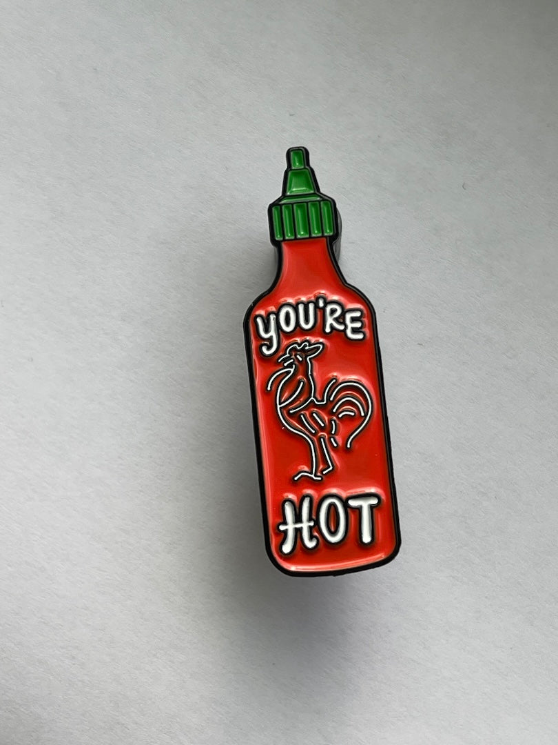 sriracha bottle enamel pin the says You're Hot