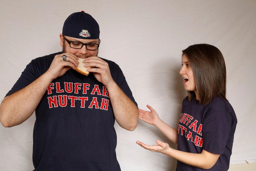 Guy eating a Fluffernutter sandwich wearing a Boston Fluffernutter sandwich