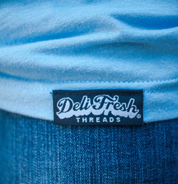 Sewn hem Deli Fresh Threads tag of t-shirt
