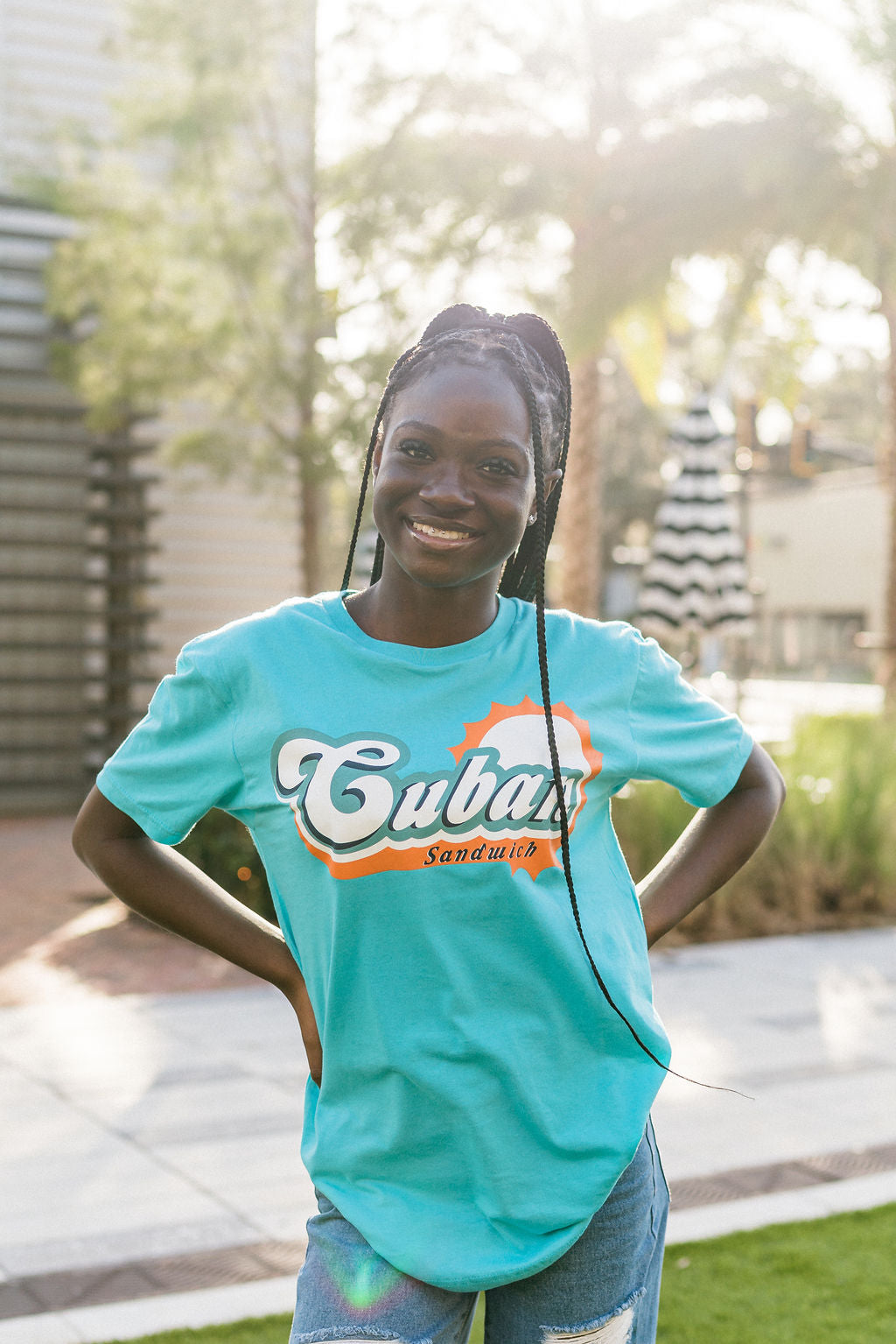 Girl wearing a Miami Cuban Sandwich shirt