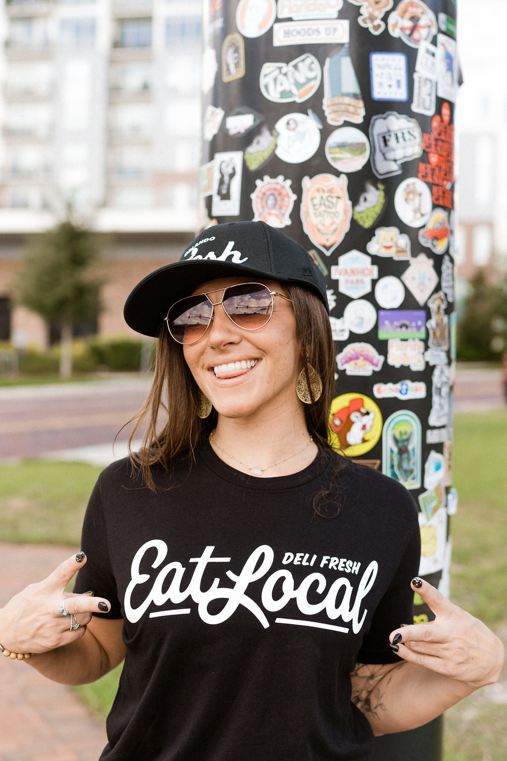 Girl wearing black Eat Local T-shirt