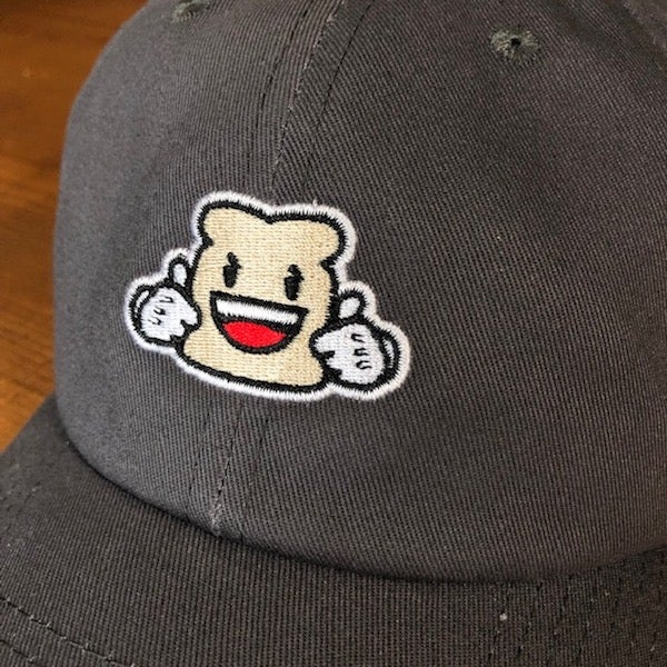 Close up the charcoal relaxed fit hat and Biggie Bread embroidered mascot