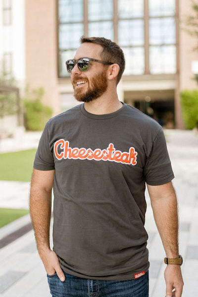 Guy wearing a Philadelphia Cheesesteak shirt