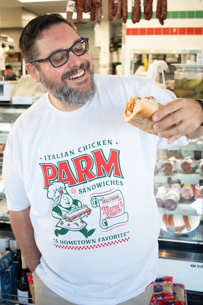 Guy holding a Chicken Parm sub wearing a Chicken Parmigiana Sandwich T-shirt