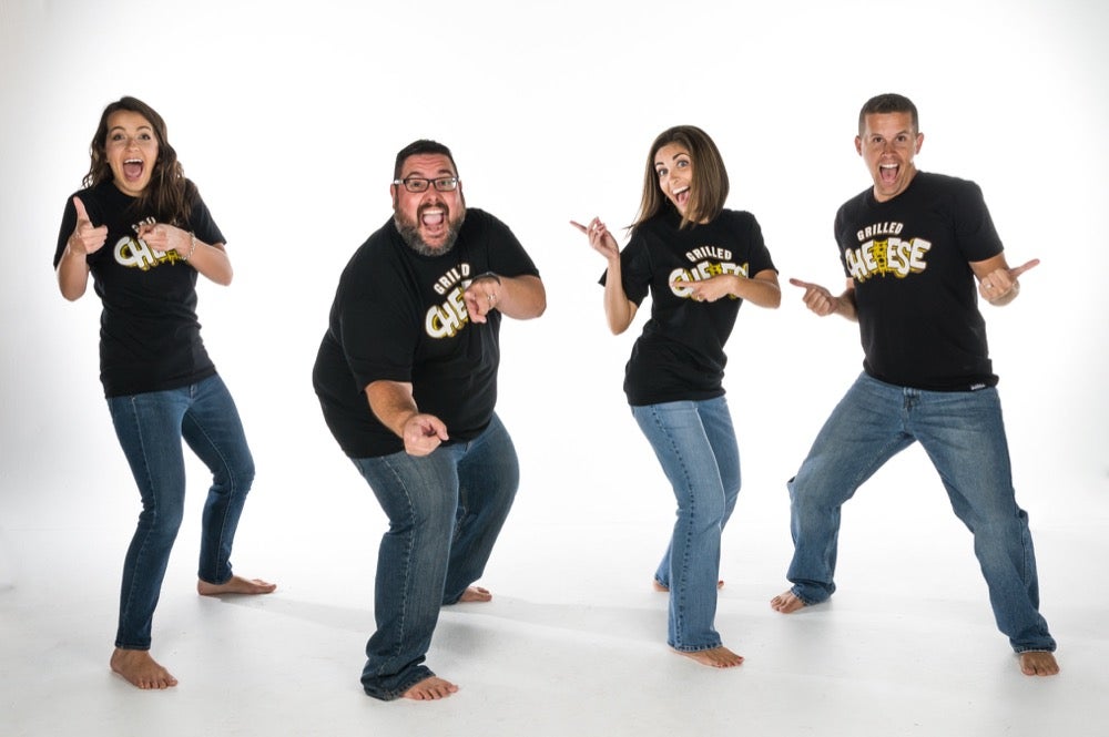 Group posing wearing a black Grilled Cheese T-shirts