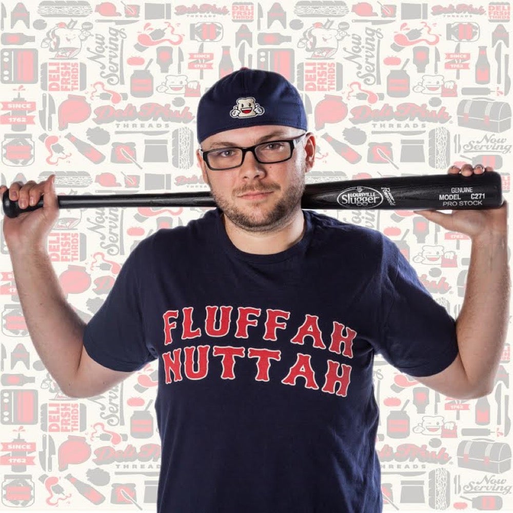 Guy with bat wearing a Boston Fluffernutter T-shirt