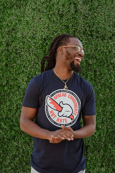 Guy wearing Spread Condiments Not Hate T-shirt