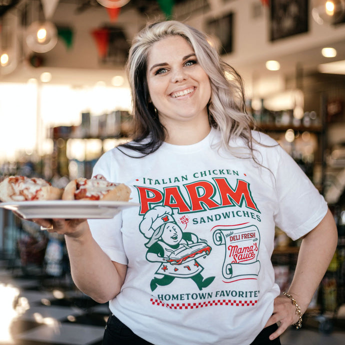 Girl holding a plate of Chicken Parm wearing a Chicken Parmigiana Sandwich T-shirt